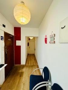 a waiting room with two chairs and a hallway at Rooms in Madrid Downtown in Madrid