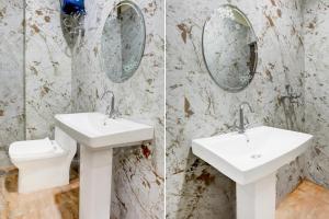 a bathroom with two sinks and a toilet at Hotel O Kalyanpur Near IIT Kanpur in Kānpur +38 photos