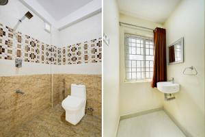 Super Hotel O Mahabalipuram Formerly The Posh Palace في مهاباليبورام: حمام مع مرحاض ومغسلة