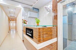 a lobby of a hotel with a reception counter at Collection O Niladri Road in Kammasandra