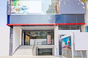 a building with a staircase in front of it at Collection O Niladri Road in Kammasandra