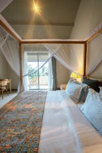 Postel nebo postele na pokoji v ubytování Rekawa Wellness Resort