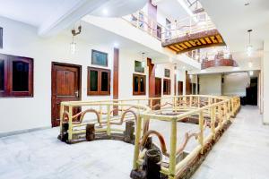 a room with two bunk beds in it at Hotel O by OYO Subhani Building Formerly Hotel Amandeep in Ludhiana