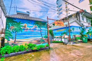 a mural on the side of a building at S79 Phu Van Aires Beach Bungalow in Phu Quoc