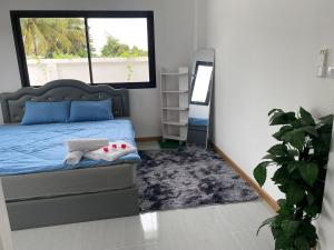Ένα ή περισσότερα κρεβάτια σε δωμάτιο στο Siam Home Chiang Mai