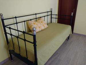 Un pat sau paturi într-o cameră la Icaro