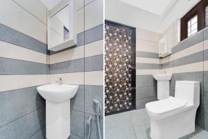 a bathroom with a toilet and a sink at Super Collection O Valiyavila Junction Formerly Prism Heights in Trivandrum