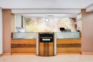 a view of the front desk of a tokyo office at Townhouse Margao Near Railway Station Formerly Hotel Tanish in Goa