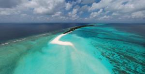an island in the middle of the ocean at Three Hearts Guesthouse and Villas in Fulhadhoo