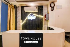 a view of a room with a townhouse sign on the wall at OYO Townhouse Civil Lines Prayagraj Formerly Raj Mahal Palace in Civil Lines