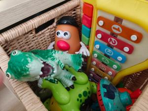 a basket filled with toys and other toys at Sandy Ridge in Kalamaki Heraklion +25 photos