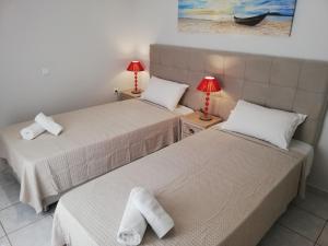 Ένα ή περισσότερα κρεβάτια σε δωμάτιο στο Ofiousa