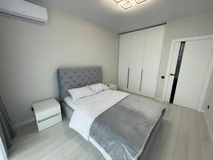 Ένα ή περισσότερα κρεβάτια σε δωμάτιο στο Апартаменти Pasichna Strit Масив Пасічний, Зелена