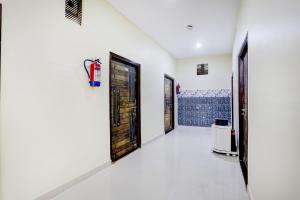 a hallway with two doors and a room with a heater at Super Collection O Nagwa Lanka Varanasi in Varanasi