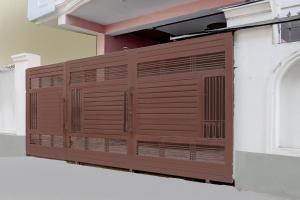 a brown garage door on the side of a building at Super Collection O Nagwa Lanka Varanasi in Varanasi +57 photos