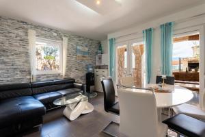 a living room with a couch and a table at Bayview Villa by Pag tours in Pag +52 photos