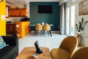 a living room with a couch and a table at Beachfront apartment with a view in Xylokastro