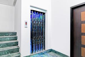 a door with a metal gate on a building at Super Hotel O Santragachi Junction Formerly Hotel Shubra in Kolkata