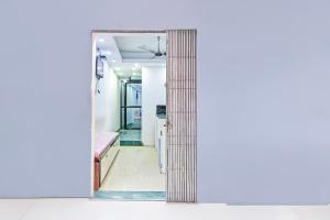 an open door into a room with a hallway at Super Hotel O Santragachi Junction Formerly Hotel Shubra in Kolkata +34 photos