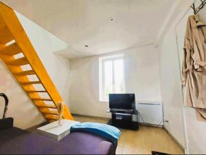 Televisyen dan/atau pusat hiburan di Le Little Cosy calme et confort