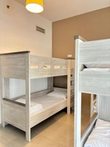 a room with two bunk beds in it at LYO guest house Dubai marina BEDSPACE in Dubai