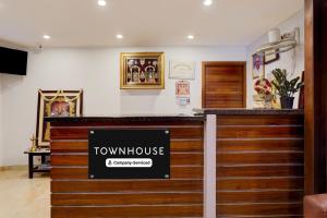 a view of a townhouse restaurant with a sign on the counter at Super Townhouse Arcot Road Near Kauvery hospital in Chennai