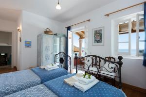 a bedroom with two beds with towels on them at Jasmine in Kalami +32 photos