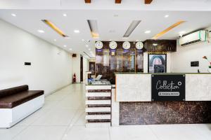a lobby of a store with a reception counter at Collection O Bangalore Airport Road in Bangalore