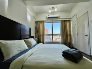 a bedroom with a large bed with a large window at Casa Mutiara Condo Bukit Bintang KLCC Kuala Lumpur by Travelardor in Kuala Lumpur +41 photos