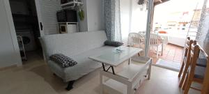 a living room with a couch and a table at Brisa y Mar in Calahonda