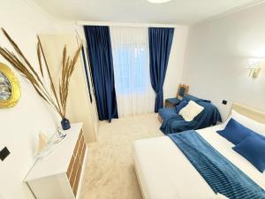 Postel nebo postele na pokoji v ubytování Aurora Apartment