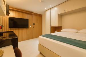 Televisyen dan/atau pusat hiburan di Paradise by Hosppedar
