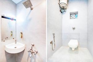 a white bathroom with a sink and a toilet at Super Hotel O Katol Road Friends Colony in Nagpur