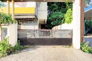 a building with a bench in front of it at Super Hotel O Katol Road Friends Colony in Nagpur +43 photos