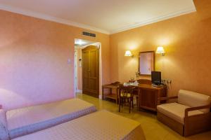 TV a/nebo společenská místnost v ubytování Hotel Conchiglia d'Oro