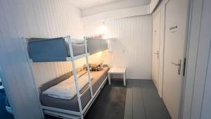 a room with two bunk beds and a desk at Daheim in Essen in Essen +68 photos