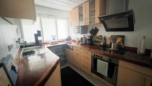 a kitchen with a sink and a stove top oven at Daheim in Essen in Essen