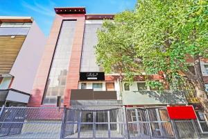 a building with a gate in front of it at Collection O Tilak Nagar Near Pacific Mall in New Delhi