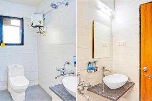 a bathroom with a toilet and a sink at Townhouse Amanora Park Town Formerly Samrat Inn in Pune