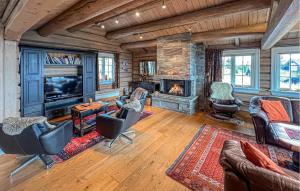 a living room filled with furniture and a fireplace at Nice Home In Lillehammer in Lillehammer