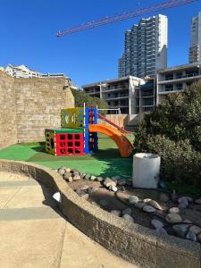 a playground in a park with a colorful at Departamento Full Equipado in Concón