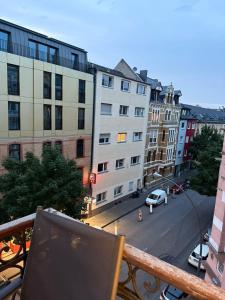a view of a city street from a balcony at Schönes Apartment in der nähe vom Hauptbahnhof in Koblenz