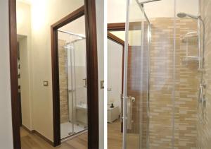 a glass shower with a glass door in a bathroom at Casa Lecci 29 in Volterra