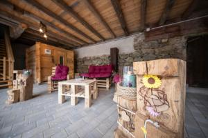 a room with two chairs and a table in a building at Waldviertel Auszeit - Lichtung im Wald - Alleinlage in Scheiben