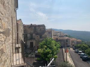 a view of a town with cars parked on a street at Casa Di Poeta in Casacalenda +5 photos