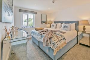 a bedroom with a large bed and a window at 1 Bed in Clyst Honiton oc-c32989 