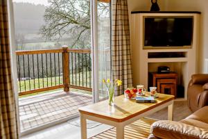 a living room with a view of a balcony at 3 Bed in Two Waters Foot oc-m27335 in Cardinham +25 photos