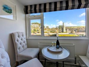 a room with a table and two chairs and a window at 3 Bed in Fowey oc-g33050 in Fowey