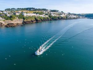 an aerial view of a boat in the water at 3 Bed in Fowey oc-g33050 in Fowey +7 photos