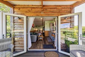 a tiny house with sliding glass doors on a deck at 1 Bed in Llandeilo oc-w33068 in Llanddeusant +25 photos